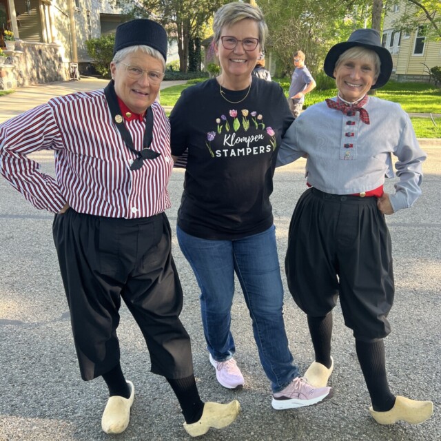 Jackie standing with 2 dutch dancers during the Tulip Time Festival