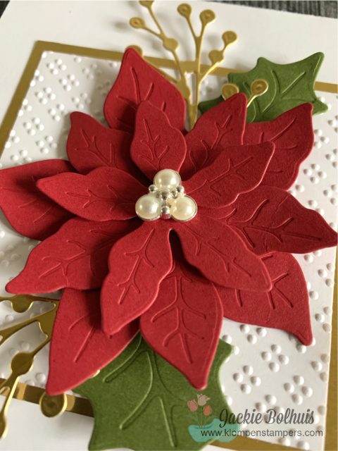 Here is a close up of pearl embellishment on top of this elegant red poinsettia