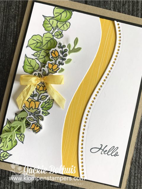 This quite curvy card features a row of hand stamped flowers colored in yellow with alcohol markers.