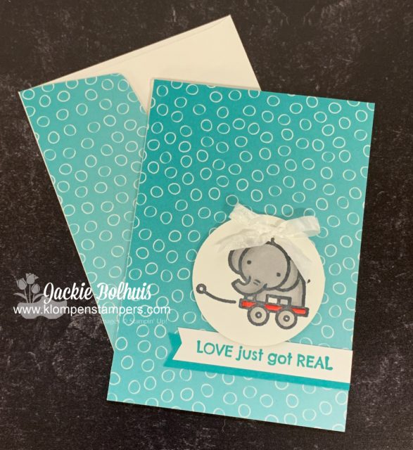 This adorable handmade baby card features a baby elephant in a wagon and some ombre designer paper. 