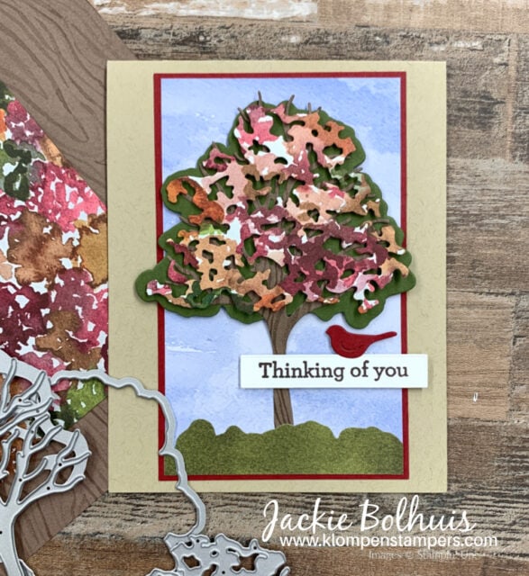 This handmade card was made as a masculine thinking of you card with tree and red bird.
