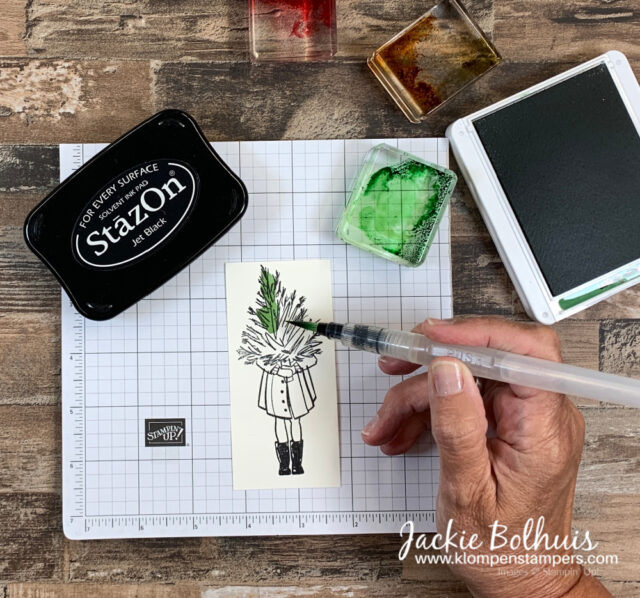 press-clear-block-onto-ink-pad-and-use-water-brush-to-pick-up-ink-and-watercolor