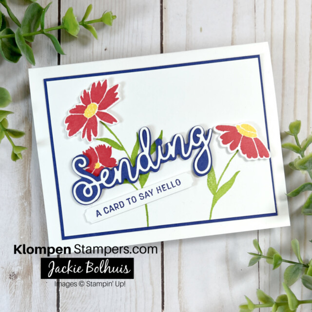 Step-up-your-card-by-adding-layer-of-navy-cardstock-behind-the-hand-stamped-sending-smiles-layer