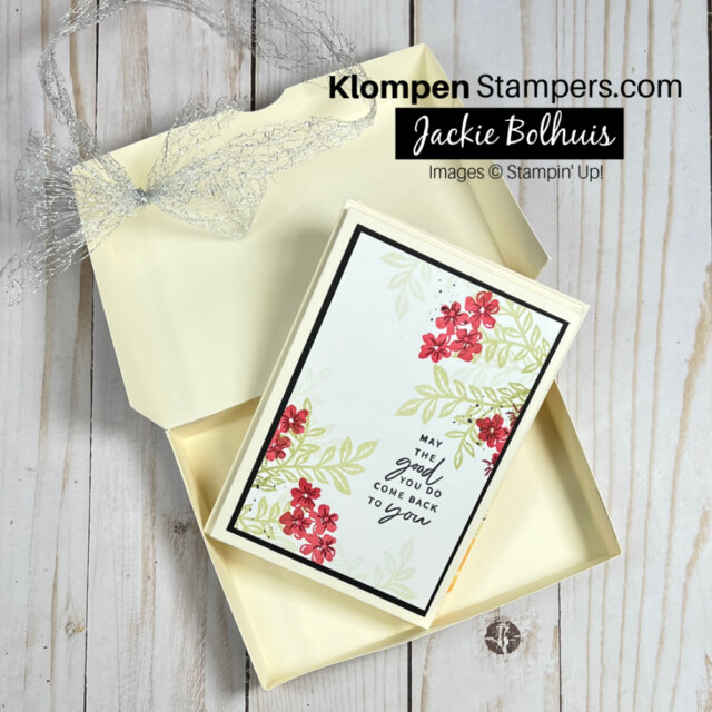 box made out of card stock that holds handmade note cards. Box is shown open with notecard inside