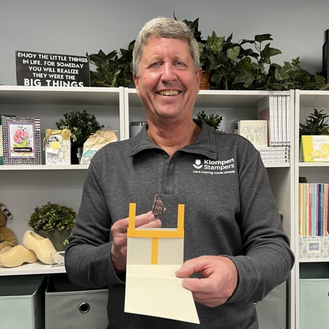 Dave holding the fun fold template that he designed by himself as a bonus fun fold for this class, on of the top card making projects of 2023!
