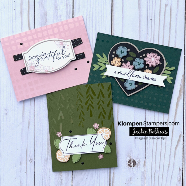 Picture of three handmade thank you cards that were created using a thank you card kit. One card is pink and reads seriously grateful for you. The second card is dark green, reads a million thanks, and has floral embellishments. The third card is green, reads thank you, and has citrus embellishments.