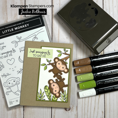 card laying on table with the stamp set called Little Monkey, punch and Stampin' Blends.  Card shows 2 monkey hanging from a tree with the words just swinging by to say hi