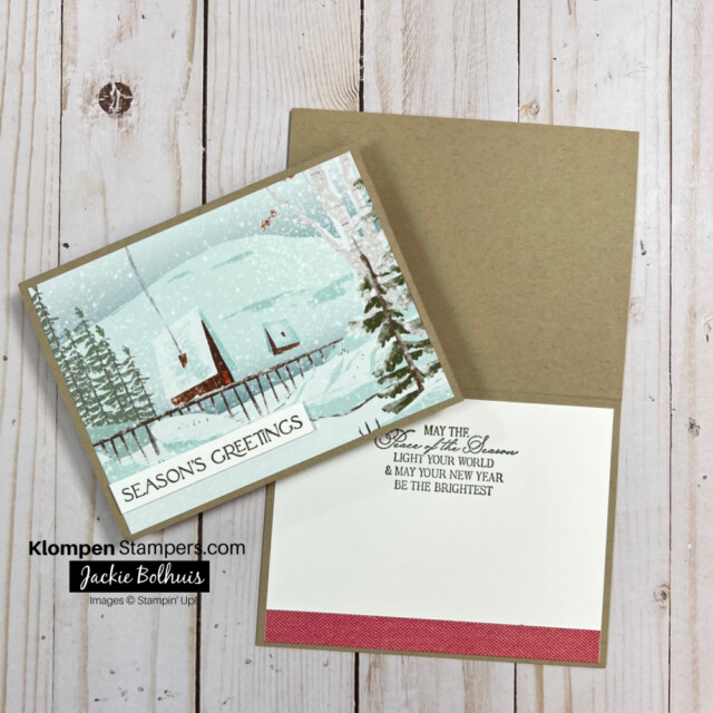 Christmas cards with the picture of a cabin in the snow covered woods and the words Merry Christmas
