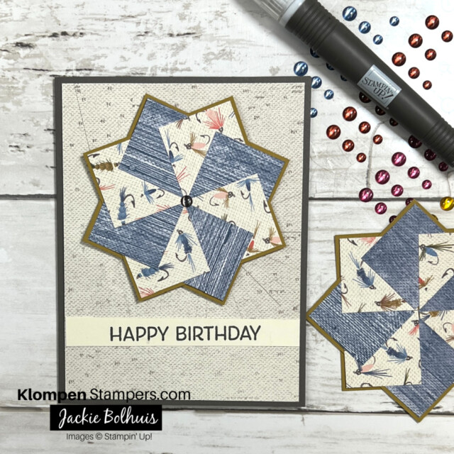 pinwheel card with the greeting Happy Birthday on it. Card is made using fishing themed scrapbook paper