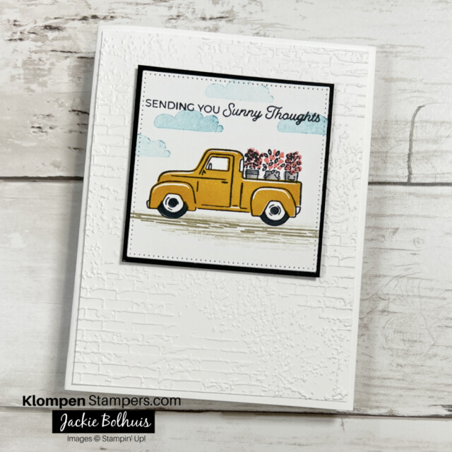 Handmade greeting card designed with the stamp set Trucking Along. Card sentiment reads "sending you sunny thoughts" and has an image of a yellow truck with three buckets of flowers in the bed of the truck.