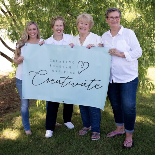 The Creativate team (Brandy, Connie, Sharon, and Jackie) holding a Creativate banner.