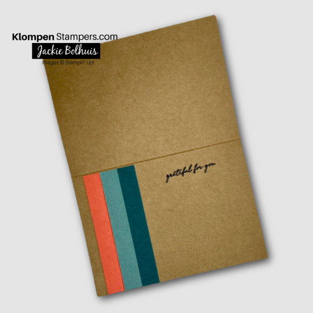 Inside of a handmade greeting card, decorated with 3 colored strips and a small stamped sentiment.