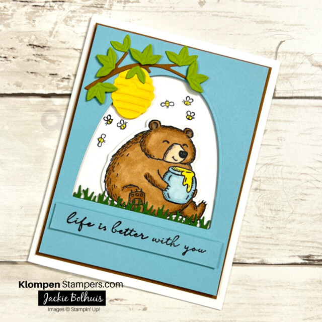 Greeting card that is designed with a fluffy bear holding a jar of honey.