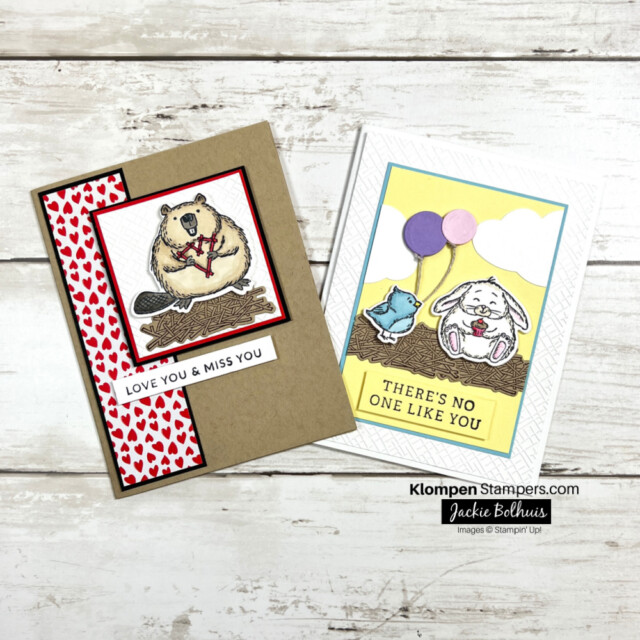 two handmade greeting cards. one is designed with a fluffy beaver and the other card is designed with a bird holding balloons standing next to a fluffy bunny.