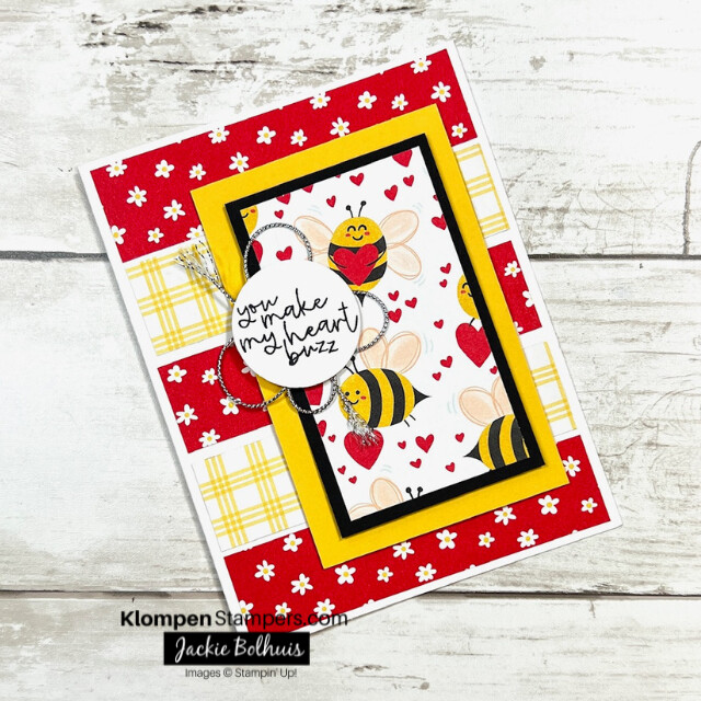 A handmade Valentine's Day card designed with the Stampin' Up! stamp set Bee My Valentine. The card is brightly designed with a happy bumble bees.