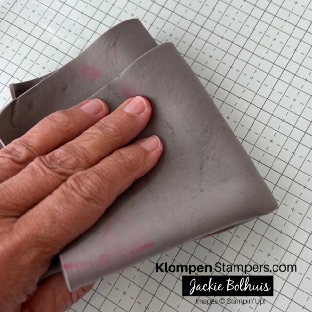 The cloth from the Stampin' Glass Mat Studio wiping the glass mat clean.