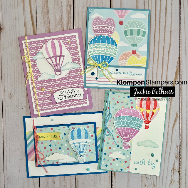 Four handmade greeting cards that lift you up with feelings of warmth and excitement. These cards are bright and colorful, decorated with an array of hot air balloons in the sky.