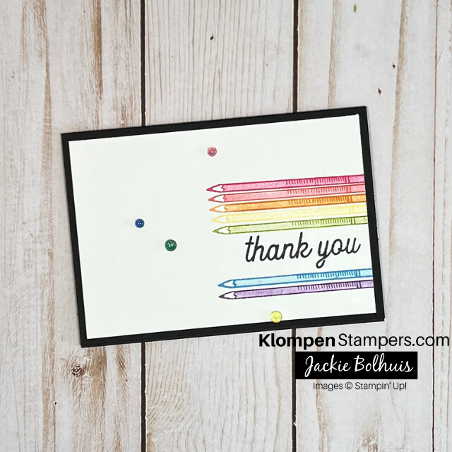 A simple thank you card that has an array of colored pencils stamped.