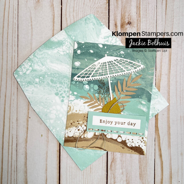 A beach themed card with a beach umbrella and a sentiment that says "enjoy your day".
