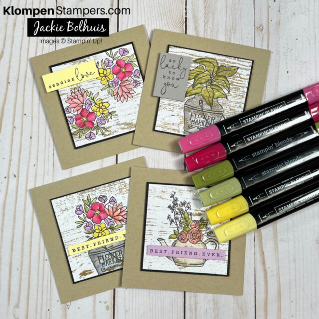 Four Country Flowers cards with pink, green, and yellow stampin' blends markers lying on top of them.