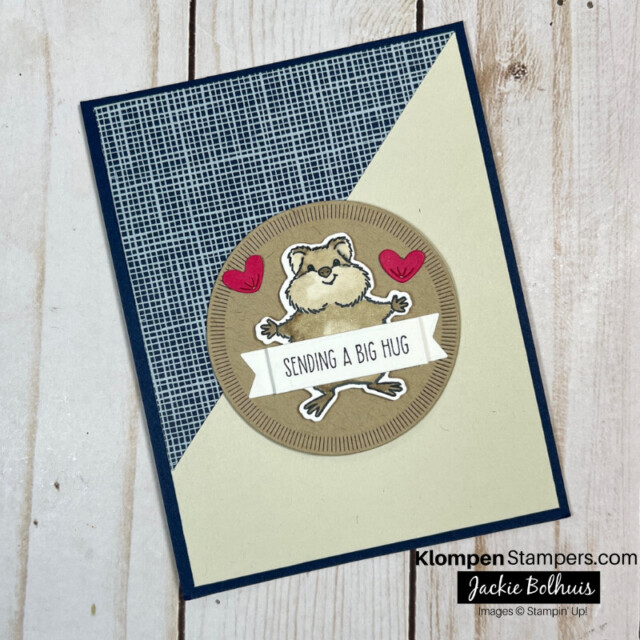 Handmade card that is half blue and half brown with a cute hamster character from the stamp set Hearts & Hugs on the front.