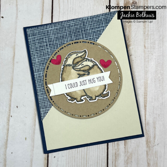 Handmade card that is half blue and half brown with cute animal characters from the stamp set Hearts & Hugs hugging on the front.