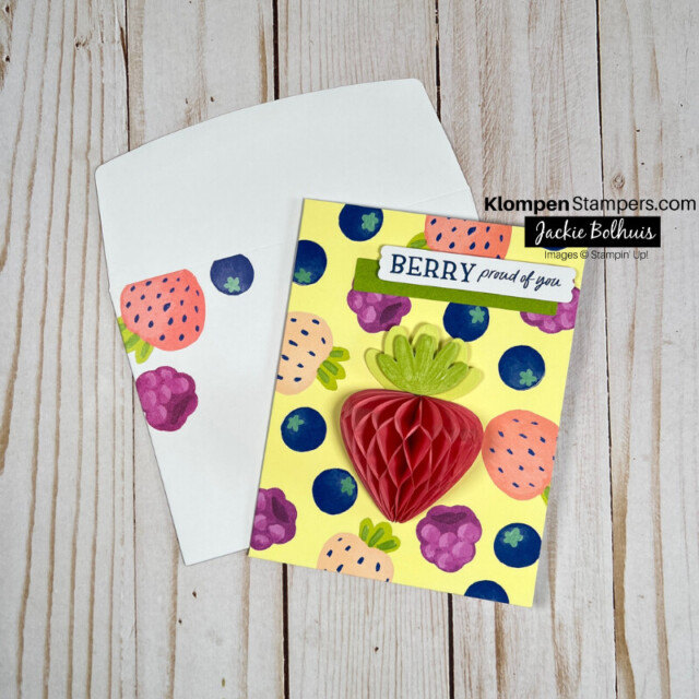 A punny celebration card. Card front along with coordinating envelope are decorated with strawberries, blueberries, and raspberries and the card sentiment reads "Berry proud of you."