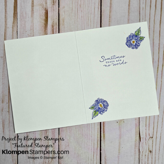 The inside of the elegant sympathy card designed with blue flowers.