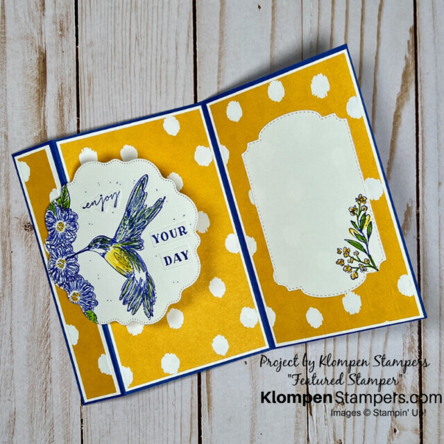 The inside of the unique fun fold card, designed brightly with yellow paper.