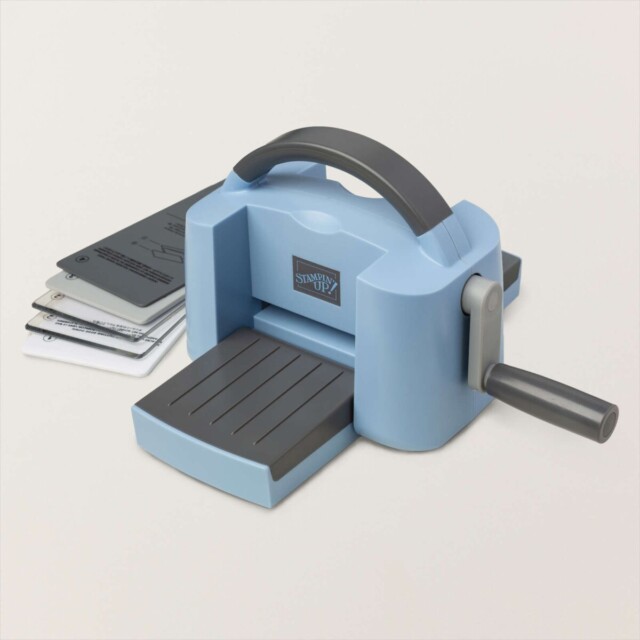 The limited edition Boho Blue Stampin' Up! Cut & Emboss Mini Machine with it's sandwich folders.