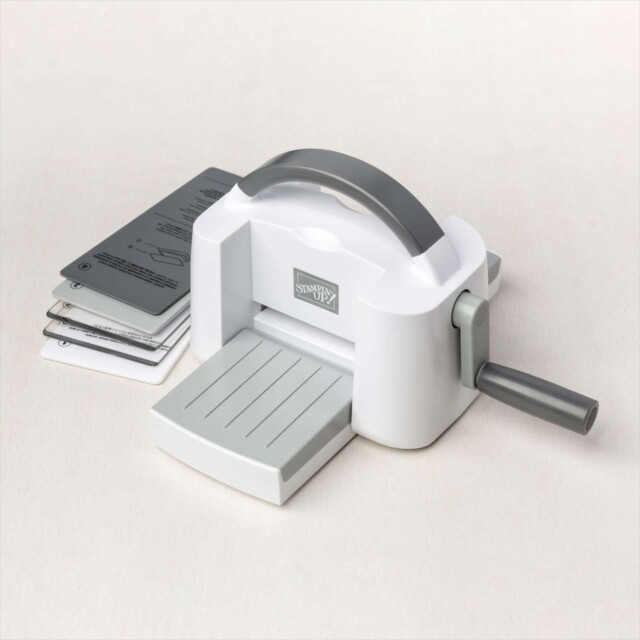 The Stampin' Up! Cut & Emboss Mini Machine with it's sandwich folders.