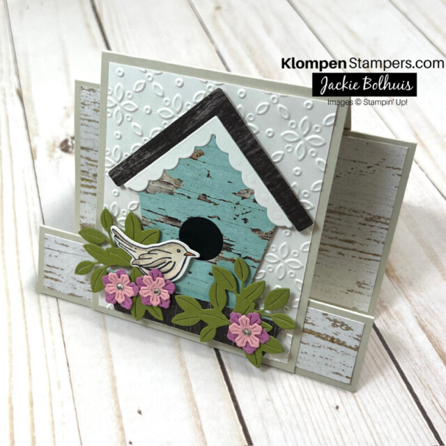 Simple fun fold card layout designed with a country charm birdhouse and die-cut flower details.