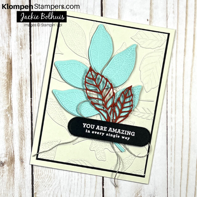 Handmade card designed with the Stampin' Up! Changing Leaves Bundle. Card has a beige background, embossed leaves on a large layer, and a blue and red die cut leave details on the front.
