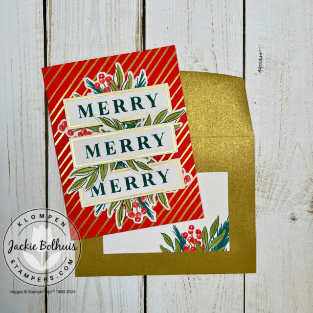 Handmade Christmas card that has a red card base with gold foil details, Christmas greenery and holly's, and three stamped sentiments that all say "MERRY", with a coordinating shimmer gold envelope.