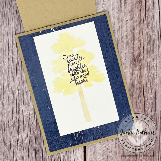 The flip top opened of the fun fold card that is designed with the Stampin' Up! Frosted Forest Bundle. Card has a soft yellow tree with a stamped sentiment under the flip top.