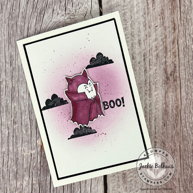 A Playful Ghosts card with a ghost dressed as a vampire. The card was designed with an easy background technique to add a purple shadow and speckles for more color.