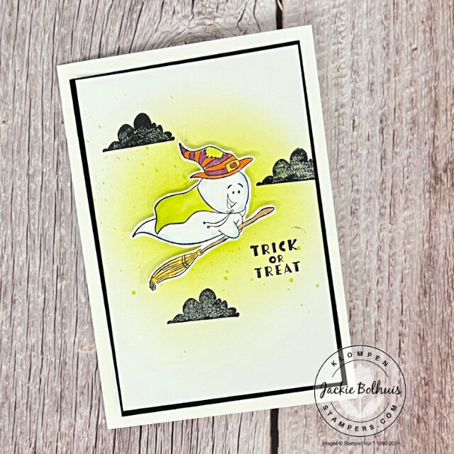 A Playful Ghosts card with a ghost dressed as a witch flying on a broom. The card was designed with an easy background technique to add a lime green shadow and speckles for more color.