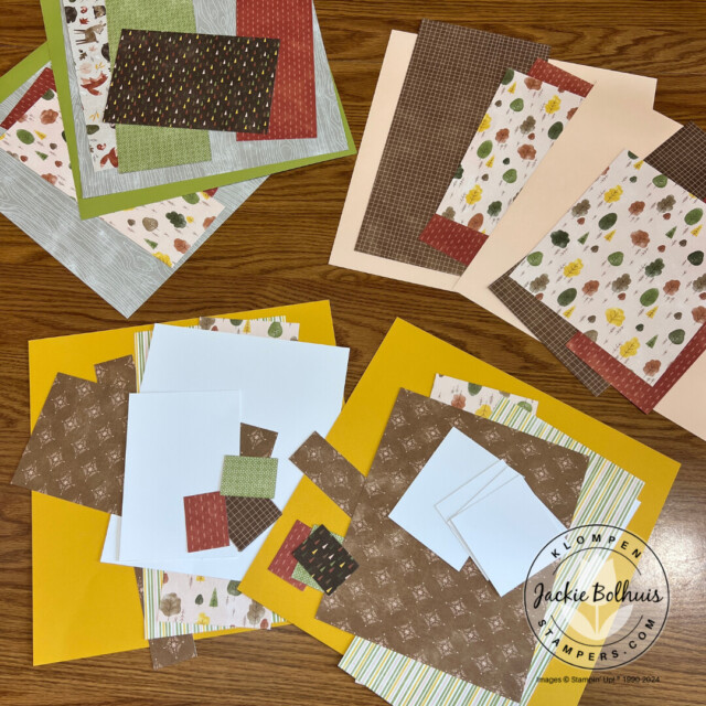 Piles of memory keeping page spread papers from the Stampin' Up! Autumn to Remember scrapbooking kit. 