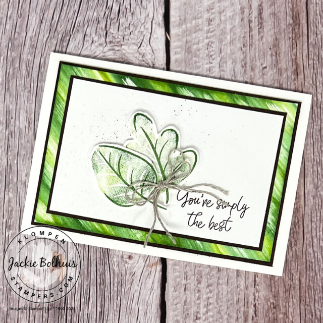 A handmade card designed with a fun and easy card making technique where you use a baby whip as an ink pad. The baby wipe was used to stamp the leave images, and then it was spread across the paper for a unique background.