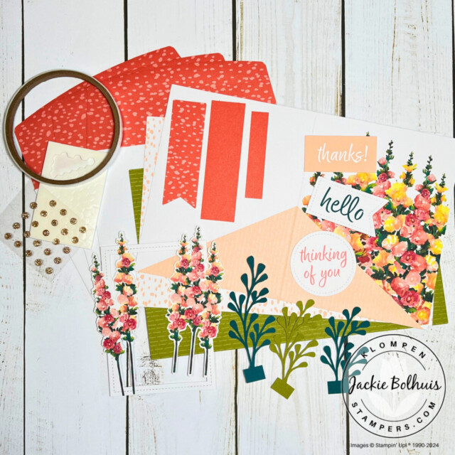 The contents of the Stampin' Up! Hello Hollyhocks all-inclusive card kit lying on a table.