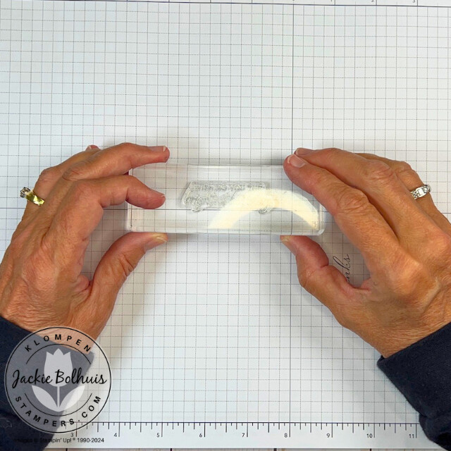 Image two of showing how to align a sentiment stamp straight on a clear block using grid paper, a lesson taught in class 1 of the the card making 101 series.