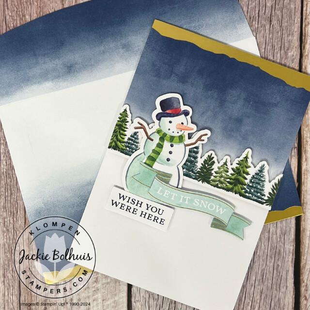 Christmas card designed with the Stampin' Up! Mix & Match products Gold Dipped Cards & Envelopes, Joyful Images Ephemera Pack, and Joyful Sayings Ephemera Pack. Card has a snowman and pine trees. on it.