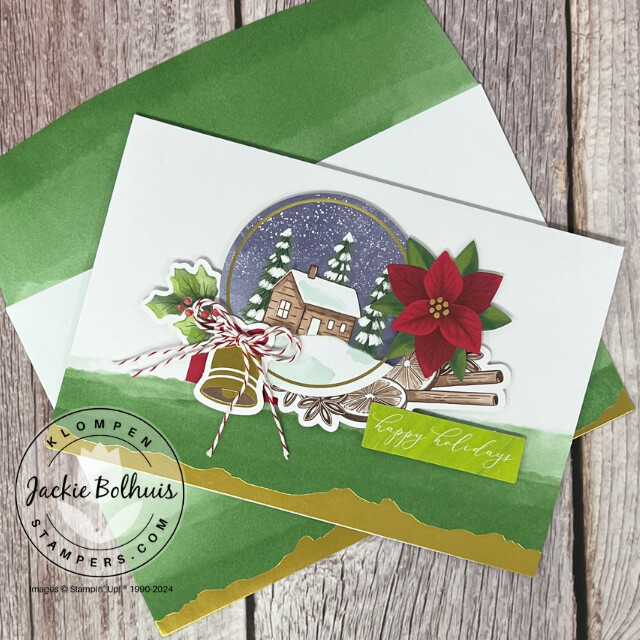 Christmas card designed with the Stampin' Up! Mix & Match products Gold Dipped Cards & Envelopes, Joyful Images Ephemera Pack, and Joyful Sayings Ephemera Pack. Card has a small cabin, bell, and poinsettia on it.