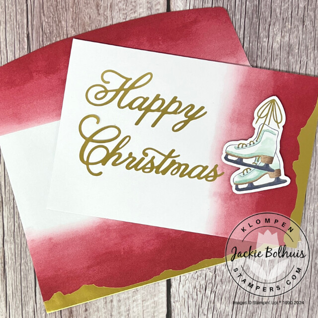 Christmas card designed with the Stampin' Up! Mix & Match products Gold Dipped Cards & Envelopes, Joyful Images Ephemera Pack, and Joyful Sayings Ephemera Pack. Card has a large "happy christmas" sentiment and ice skates on it.