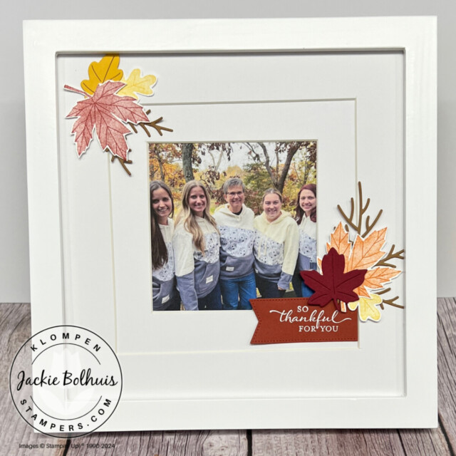 A fall picture frame craft designed with Stampin' Up! stamp set Autumn to Remember. Frame has small leave bundles in fall colors in the corneres.
