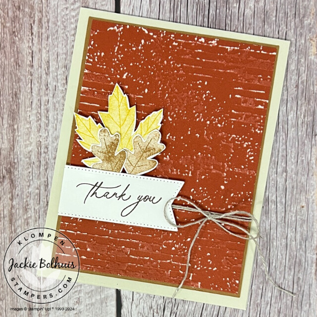 Fall themed thank you card designed with Two-Toned Cardstock and the Stampin' Up! Autumn to Remember stamp set. Card has three small stamped leaves and a distressed brick background.