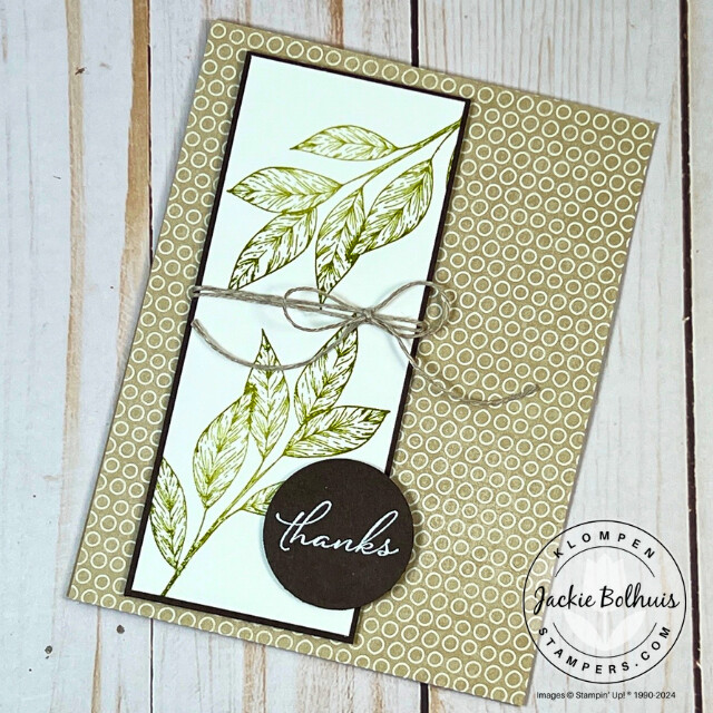 Heat emboss card example. There is green embossed leave images with a "thanks" stamped sentiment that is embossed with white embossing powder.