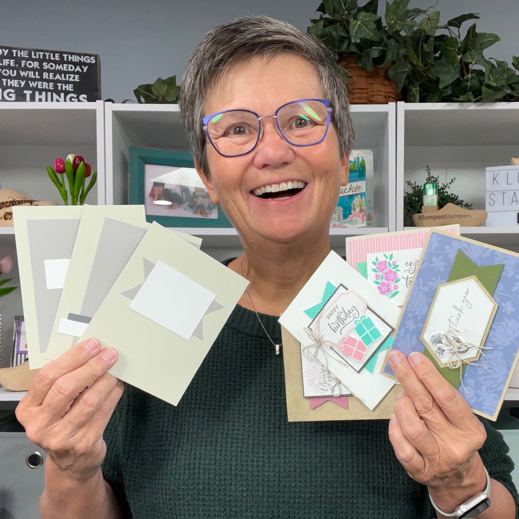 Jackie of Klompen Stampers holding three card making templates and four completed cards that were designed from the card templates from her Creativity Made Simple series.