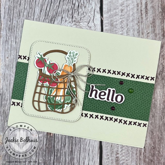 A handmade card with the sentiment "hello" and a basket filled with veggies as a focal image.
