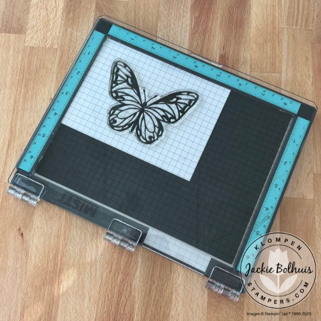 The Misti stamping tool with a butterfly stamp.